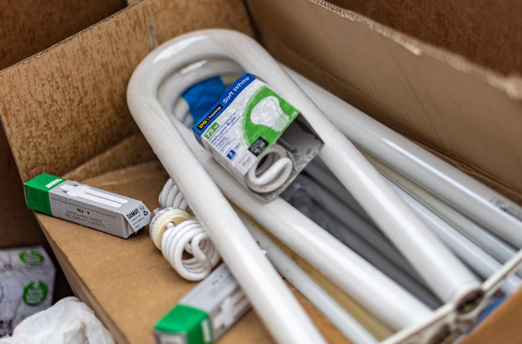 Clean Sweep 10- 08 22-10 Cardboard box of fluorescent light bulbs.