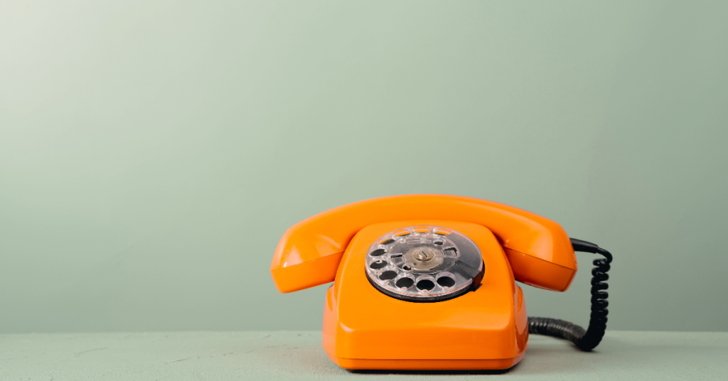 Image of orange rotary phone