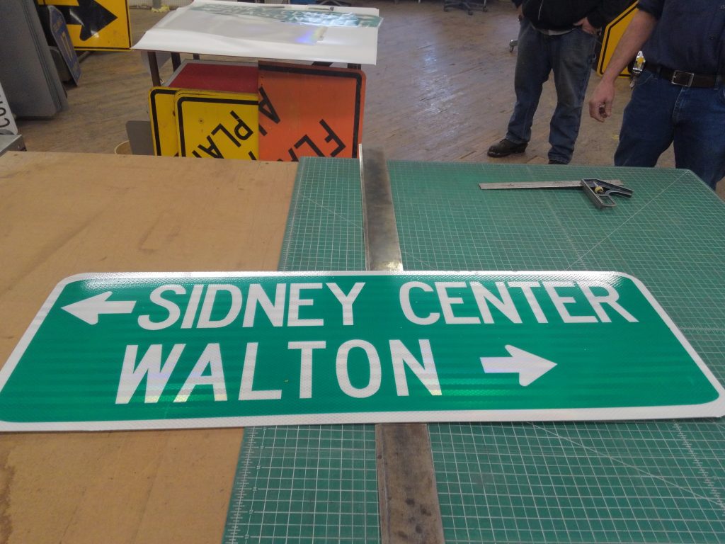 Sidney Center and Walton directional sign